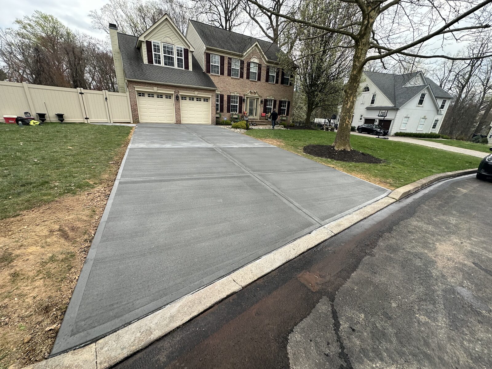 New broom-finish concrete driveway