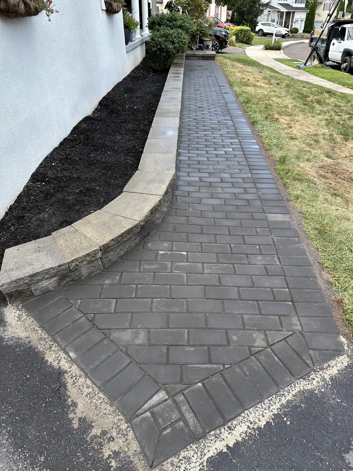Brick-paver walkway with stone border